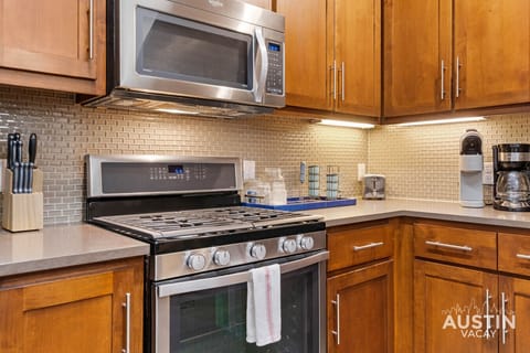 Gas range, microwave, and ample cabinetry at your fingertips