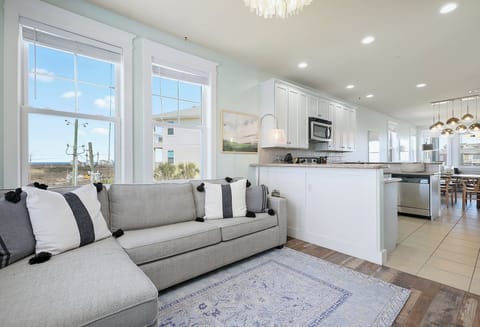 Second living area with a sleeper sofa and smart TV, offering beautiful sunset v