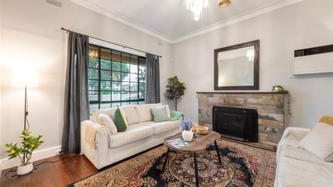 Cozy living area with fireplace and natural light