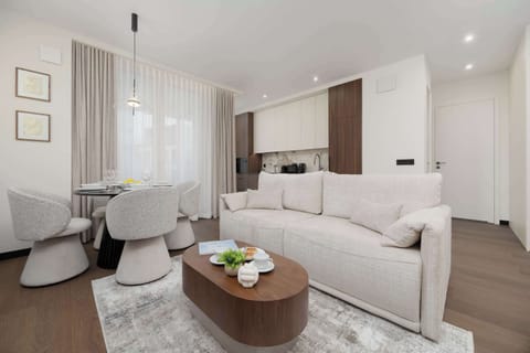 A bright and elegant living room with a comfortable sofa and stylishly selected accessories.