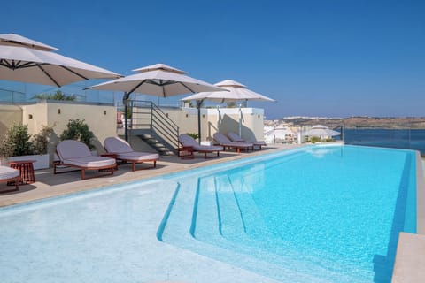 Indoor pool, outdoor pool, pool umbrellas, sun loungers