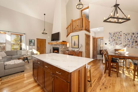 Gather around your spacious kitchen island while the fireplace crackles nearby, creating the perfect backdrop for memorable meals and conversations.
