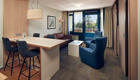 Gather for relaxed dinners and movie nights in spacious comfort.