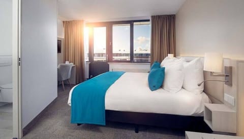 Wake up to golden light and crisp, inviting linens.