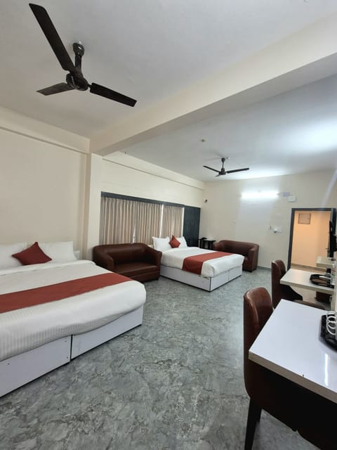 Deluxe Quadruple Room, Garden View | Desk, laptop workspace, free WiFi