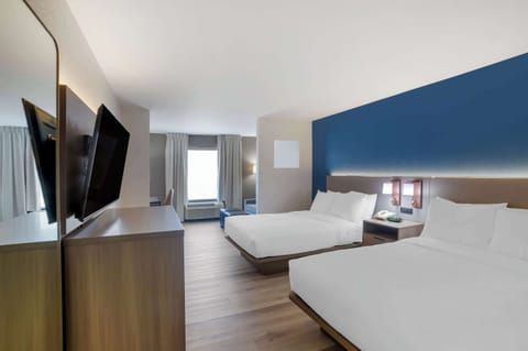 Desk, blackout drapes, iron/ironing board, free cribs/infant beds