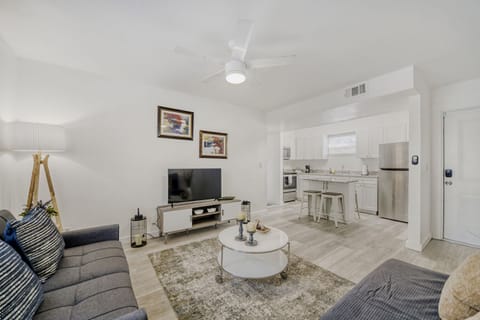 Stylish living room features a comfy sofa, flat-screen TV, and thoughtfully curated décor, creating a welcoming space to unwind.