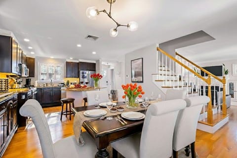 Bright and inviting dining area with a spacious table and comfortable seating. Perfect for enjoying meals, entertaining guests, or gathering with family in a warm, welcoming atmosphere.