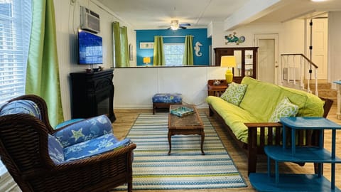 One Filsh- this studio is FUN! Vibrant colors screams beach.  Electric fireplace brings a homey feel to the room.
