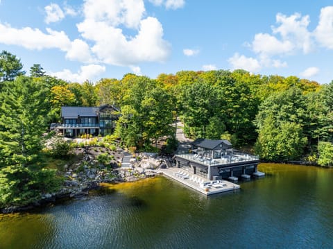 Lakeside retreat with spacious dock and lush greenery