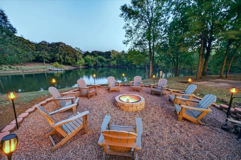 Fire pit seating area overlooking the scenic fishing pond.
