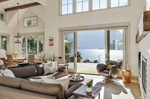 Bright living area with sliders that open to stunning lake views.