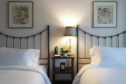 Drift off comfortably in twin beds with soft, hotel linens.