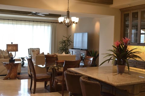 Share dinners together at the dining table under warm lighting.