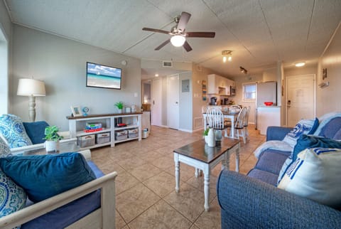 Bright, coastal-inspired living area with open dining space—perfect for easy mornings and relaxed evenings after the beach.