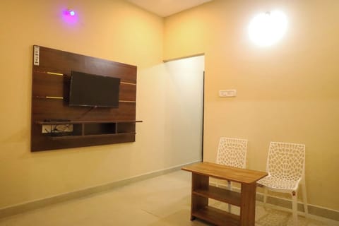 Deluxe Room, 2 Bedrooms | Living area | TV