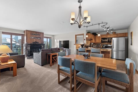 Gather around the spacious dining table where meals become memories, while natural light pours through the windows and the open kitchen invites you to cook together in this welcoming, thoughtfully designed space.