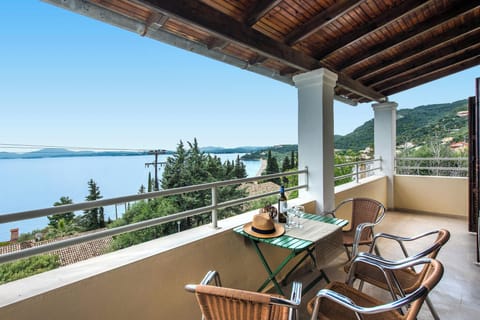 Spacious private balcony with outdoor dining table and breathtaking views of the Ionian Sea. A perfect spot to enjoy breakfast or sunset drinks while overlooking the peaceful Barbati coastline.
