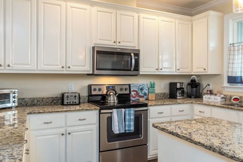 Your fully equipped kitchen invites culinary adventures with granite counters, stainless appliances, and plenty of space to create memorable meals.