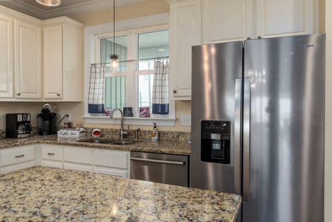 Your fully equipped kitchen features granite countertops, stainless steel appliances, and everything you need to prepare meals during your stay.