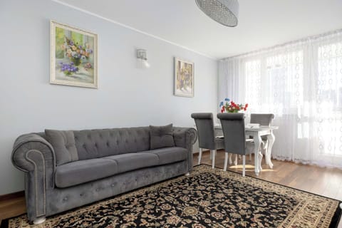 Relax in the stylish living room with a comfortable sofa and atmospheric decor.