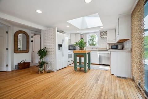 The fully equipped kitchen has everything necessary to make a great meal. A large skylight brings in amazing natural light
