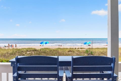 Oceanfront balcony with comfy seating and stunning views