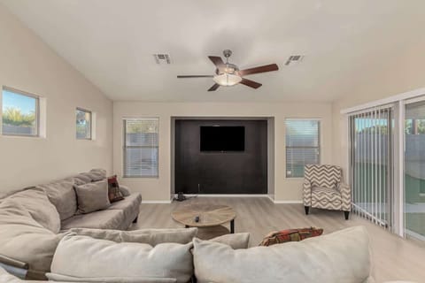 Bright living room with comfortable seating and smart TV