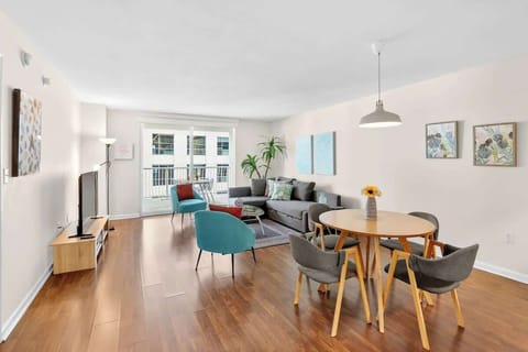 Bright living space with comfortable seating and Smart TV