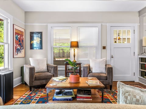 Bright, cozy living room with stylish seating and colorful charm