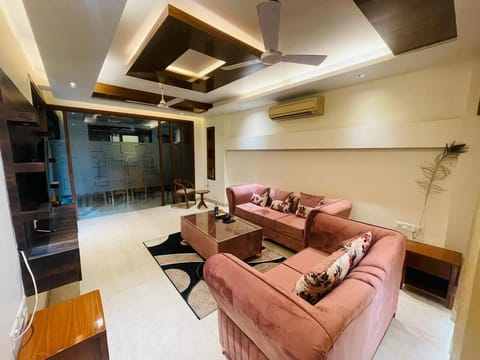 Apartment, Golf View | Living area | 43-inch Smart TV with digital channels