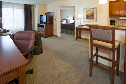 Hearing accessible one-bedroom suite with comfortable living space.