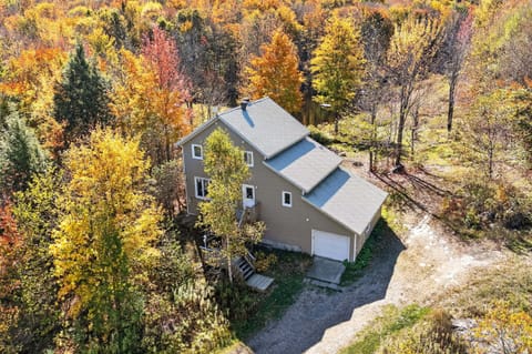 The chalet sits on two acres of untouched Laurentians woodland with no neighbors