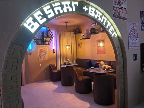 Every great adventure needs a cantina. Step through this arch and you’ll find Beskar & Banter — a place where smugglers, Jedi, bounty hunters, and families alike can relax before the next jump to hyperspace.