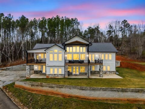 Experience stunning Carolina sunsets from this beautiful modern retreat surrounded by peaceful forest views. The perfect setting for unforgettable moments with friends and family.