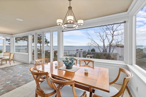 Dining with water views; table with 2 leaves expands to seat up to 8 guests.
