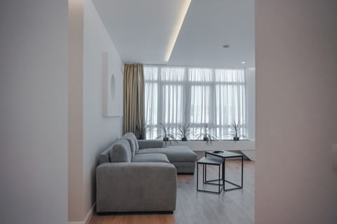 Apartment, 3 Bedrooms, Balcony | Living area | 43-cm TV with cable channels