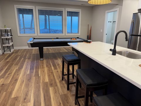 Shoot some pool while enjoying the Lake Michigan views.