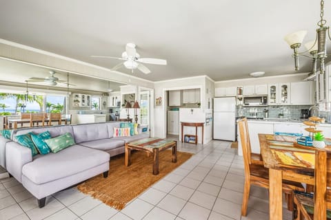 Unwind in this bright, airy space where kitchen, living, and dining areas flow together seamlessly for your perfect island getaway.