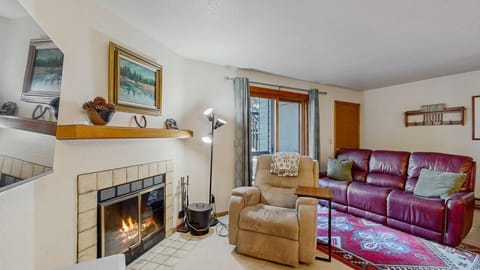 Living room with wood burning fireplace