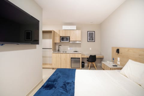 Comfort Room, Patio, Courtyard View | Minibar, in-room safe, desk, laptop workspace