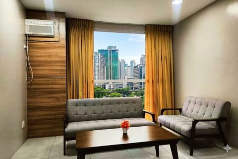 Two Bedroom Suite | Living area | 32-inch flat-screen TV with cable channels