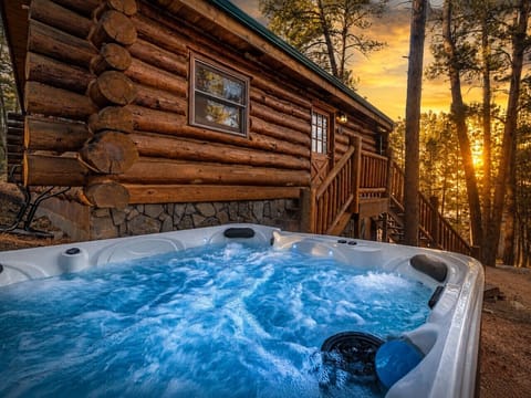 Private outdoor hot tub with forest views, ideal for relaxing after a day exploring the Black Hills.