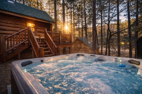 Golden hour soaks, cozy cabin nights, and fire pit evenings under the pines.