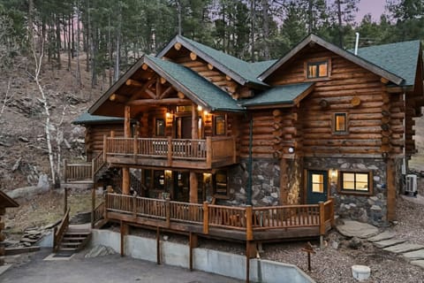 Escape to a showstopping log lodge in the pines. Spacious decks, cozy charm, and pure Hillside Country Cabin serenity.