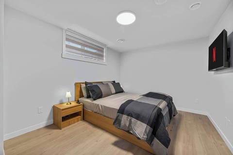 A calm and comfortable bedroom designed for a relaxing stay.