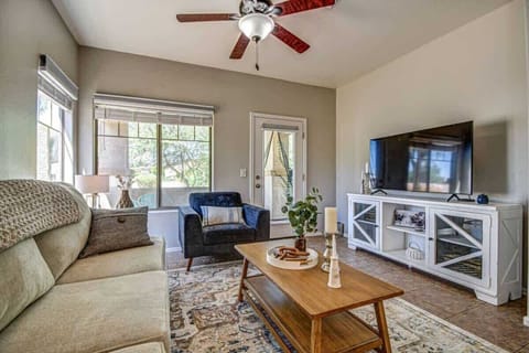 Relax in the cozy living room with Smart TV and comfy seating.