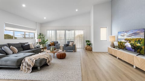 Unwind in this comfortable living area after a relaxing day by the bay.