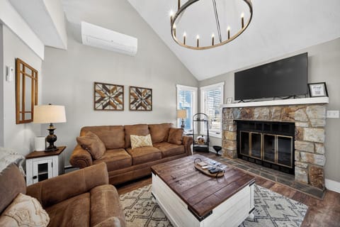 enjoy the fireplace, comfy couches and chair after a long day of skiing