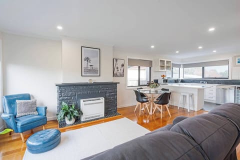 Socialise with ease in this flowing open-plan layout where built-in heating warms winter nights and meals are shared just steps away.